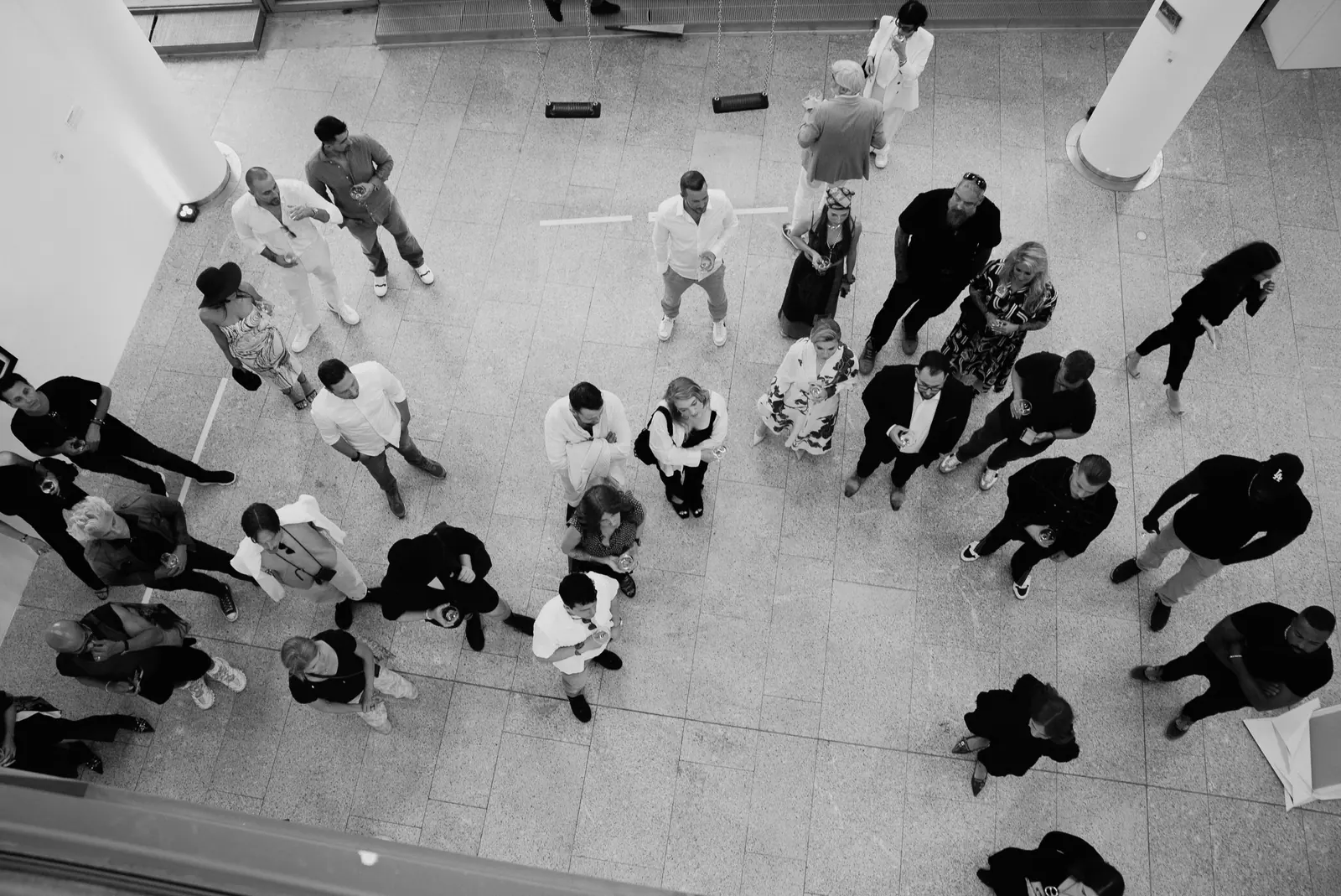 Visitors in front of paintings by Ivan Gette